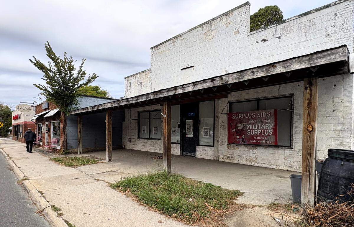 The building at 309 E. Main St. in Carrboro, NC, has housed Surplus Sid’s since 1992. Before that, the building housed an auto dealership, a service garage, and two different newspaper offices.