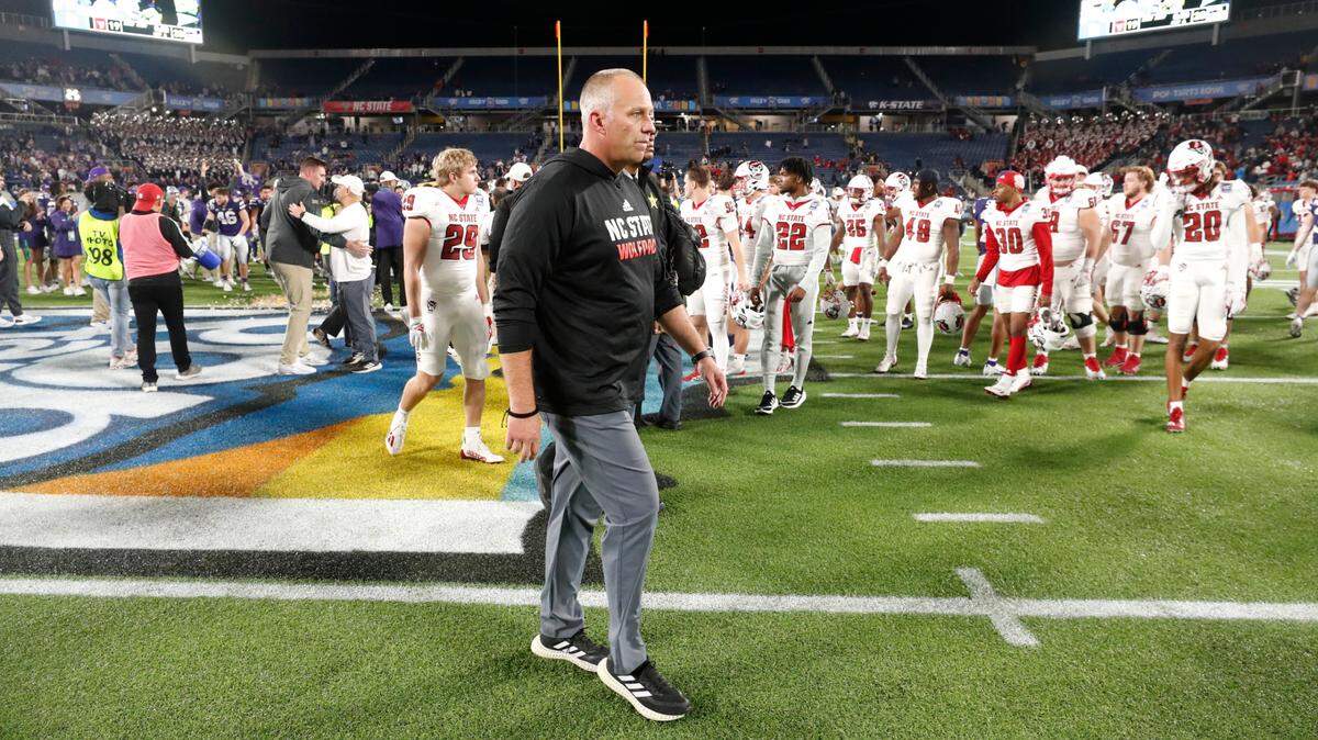 N.C. State head coach Dave Doeren walks off the field after Kansas State’s 28-19 victory over N.C. State in the Pop-Tarts Bowl at Camping World Stadium in Orlando, Fla., Thursday, Dec. 28, 2023.