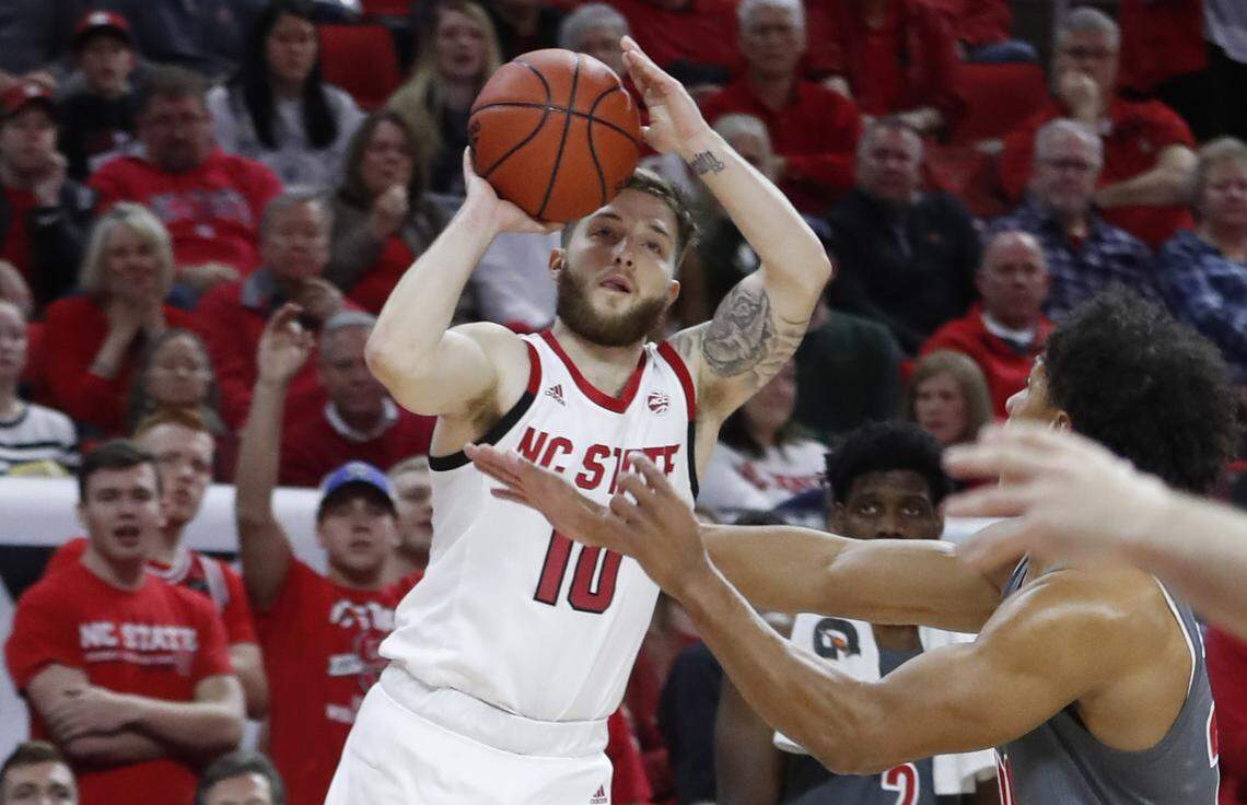 N.C. State’s Braxton Beverly (10) makes a three-pointer during the first half of N.C. State’s game against Louisville at PNC Arena in Raleigh, N.C., Saturday, Feb. 1, 2020.