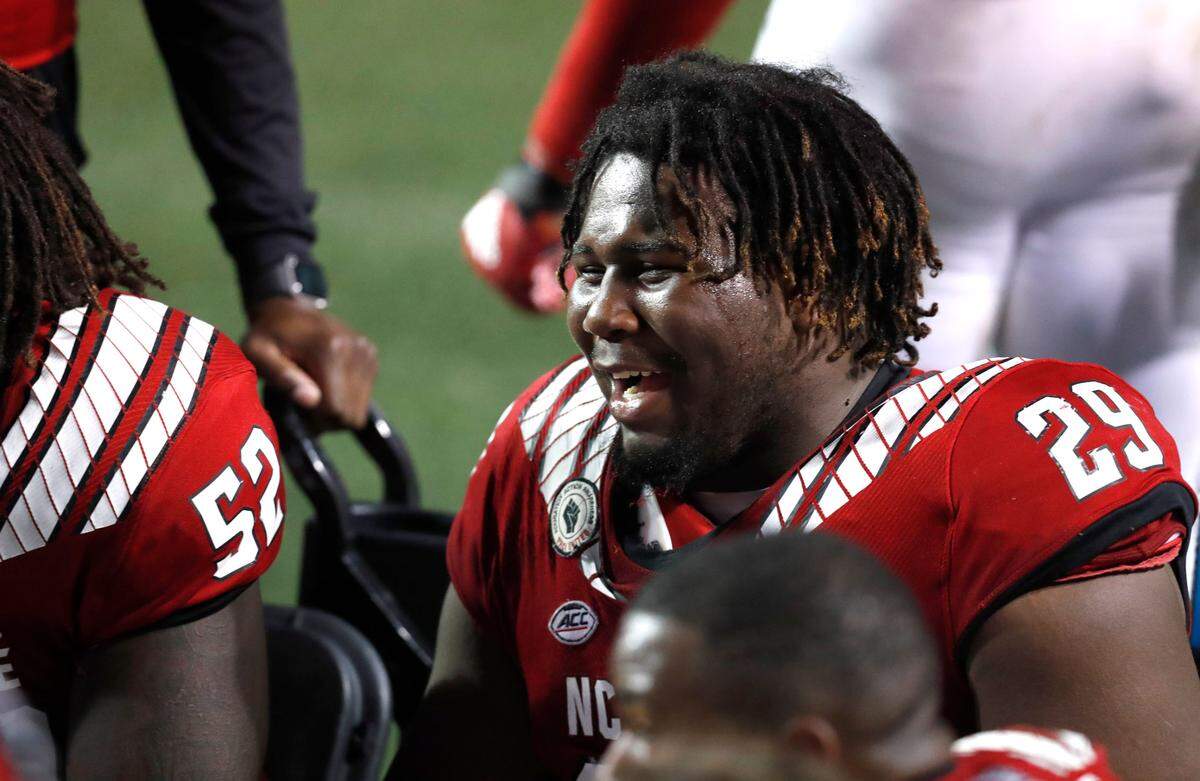 N.C. State defensive tackle Alim McNeill (29) laughs during the second half of N.C. State’s 15-14 victory over Liberty at Carter-Finley Stadium in Raleigh, N.C., Saturday, Nov. 21, 2020.