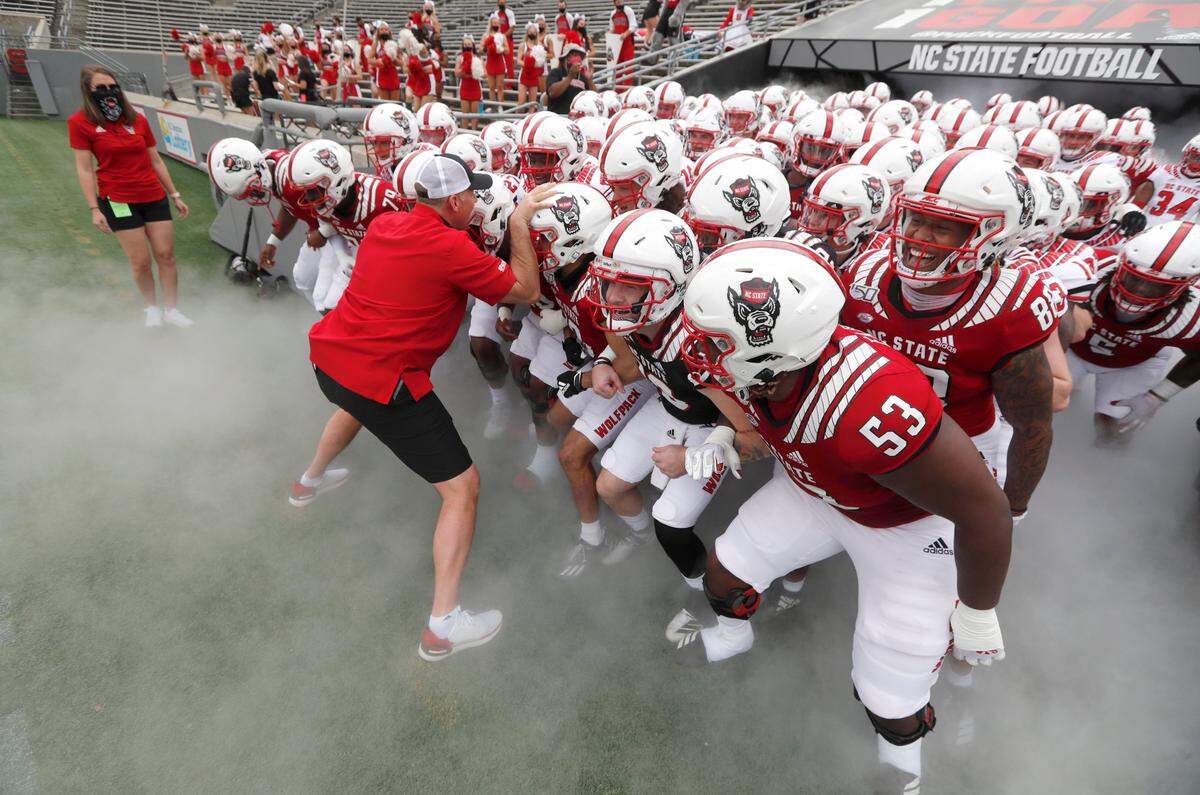 N.C. State head coach Dave Doeren prepares to lead the team onto the field before the Wolfpack’s spring game at Carter-Finley Stadium in Raleigh, N.C., Saturday, April 10, 2021.