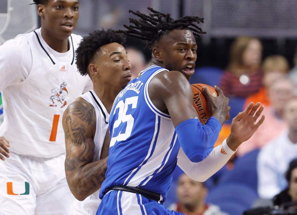Duke’s Mark Mitchell (25) works against Miami’s Jordan Miller (11) during the first half of Duke’s game against Miami in the semifinals of the ACC Men’s Basketball Tournament in Greensboro, N.C., Friday, March 10, 2023.