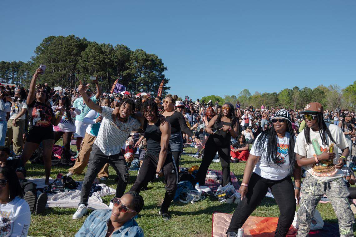 People dance while waiting for Monica to perform at the second day of Dreamville Festival in Raleigh, N.C. on Sunday, April 7, 2024.