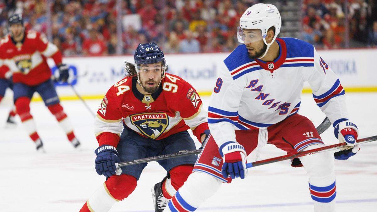 Florida Panthers left wing Ryan Lomberg (94) skates up to New York Rangers defenseman K’Andre Miller (79) during the second period of Game 3 of the Eastern Conference finals of the NHL hockey Stanley Cup playoffs at the Amerant Bank Arena on Sunday, May 26, 2024, in Sunrise, Fla.