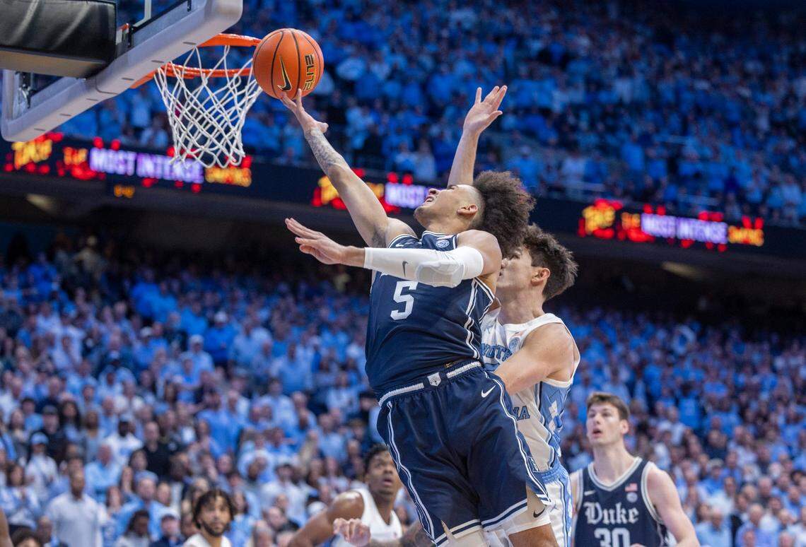 Duke’s Tyrese Proctor (5) drives to the basket against North Carolina’s Cormac Ryan (3) in the first half on Saturday, February, 3, 2024 at the Dean E. Smith Center in Chapel Hill, N.C.
