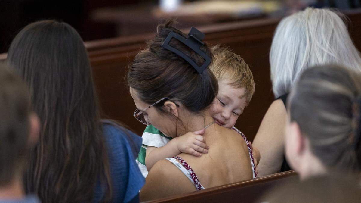 Jessica Oriente holds her and David Millette Jr.’s son Sunny David Millette during a sentencing hearing for Tyrell Moore on Monday, June 1, 2026, at the Wake County Justice Center in Raleigh. Moore pleaded guilty earlier this year to voluntary manslaughter in the death of David Millette Jr., who died after Moore struck him during a confrontation in Raleigh's Glenwood South district in August 2023.