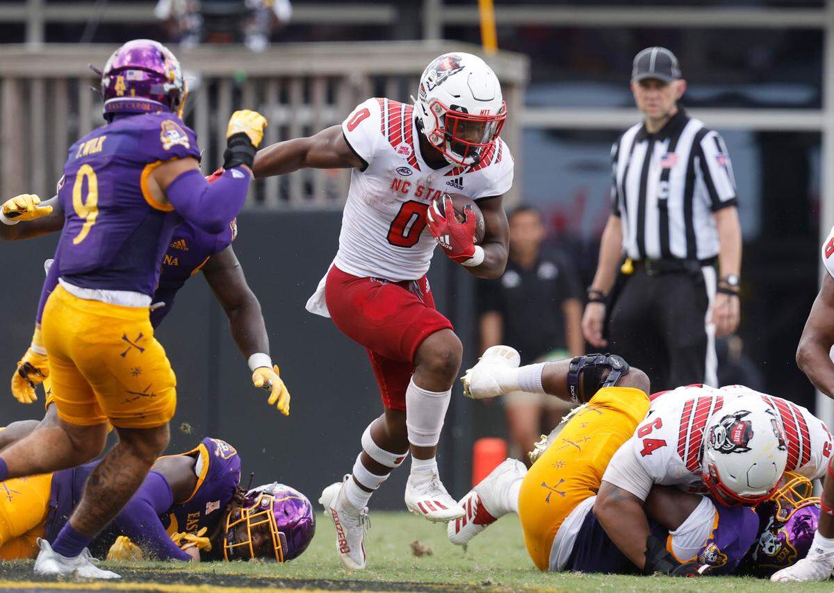 N.C. State running back Demie Sumo-Karngbaye (0) gains yards during the first half of N.C. State’s game against ECU at Dowdy-Ficklen Stadium in Greenville, N.C., Saturday, Sept. 3, 2022.