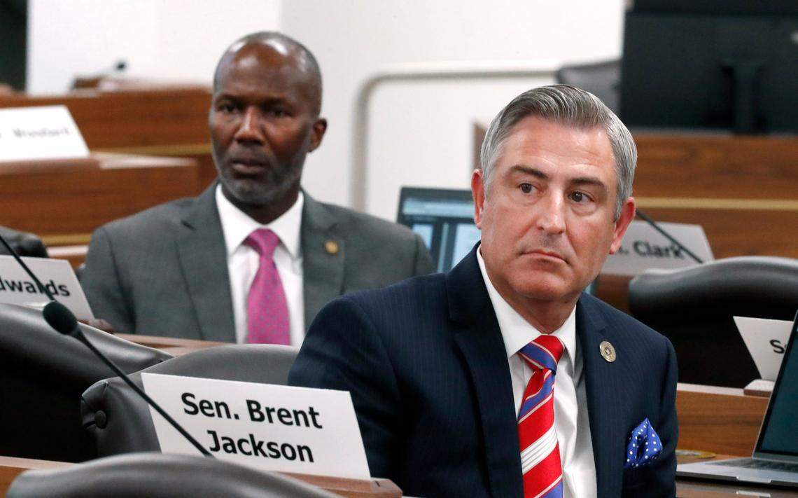 Sen. Kirk deViere, right, and Sen. Ben Clark listen to a speaker during a meeting of the Senate Finance Committee in Raleigh, N.C., Wednesday, June 30, 2021.