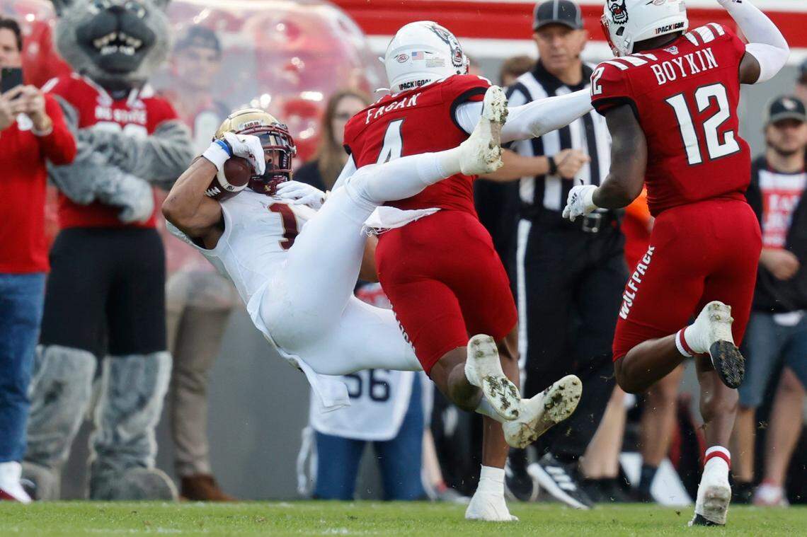 Boston College wide receiver Jaelen Gill (1) makes the reception while being hit by N.C. State safety Cyrus Fagan (4) during the first half of N.C. State’s game against Boston College at Carter-Finley Stadium in Raleigh, N.C., Saturday, Nov. 12, 2022.