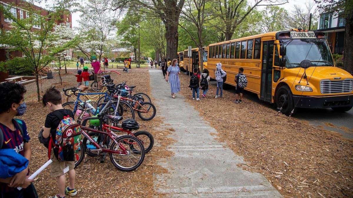 Students are dismissed from George Watts Elementary School in Durham Tuesday, April 12, 2022. Durham’s public school system will begin using a new model for assigning students to schools in the 2023-24 school year, in an attempt to increase equity.
