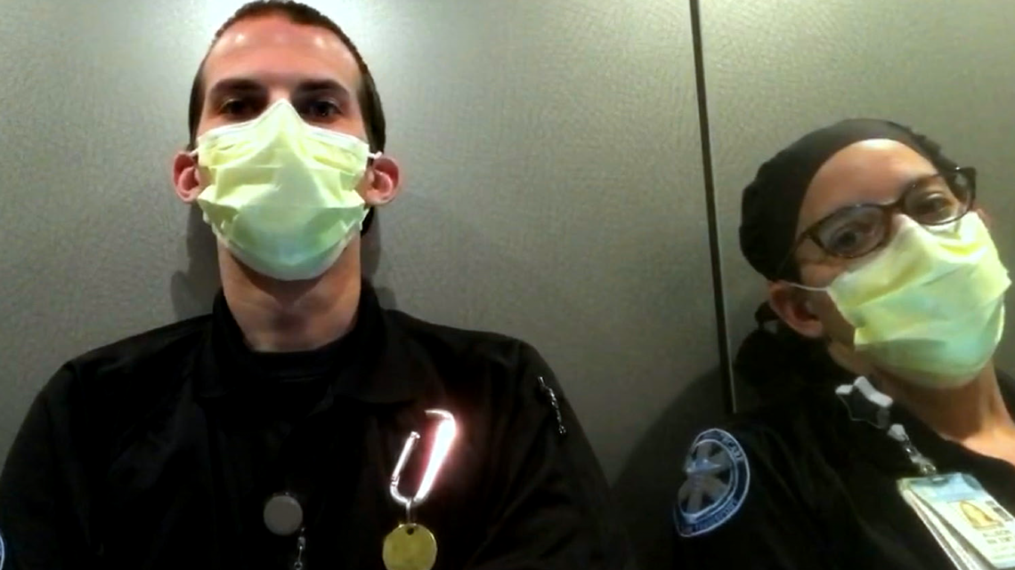 Allison Adams, right, and colleague Ryan C. after a rough day of medical transport that included a potential COVID-19 case. They appear in the PBS “American Portrait” special “In This Together.”