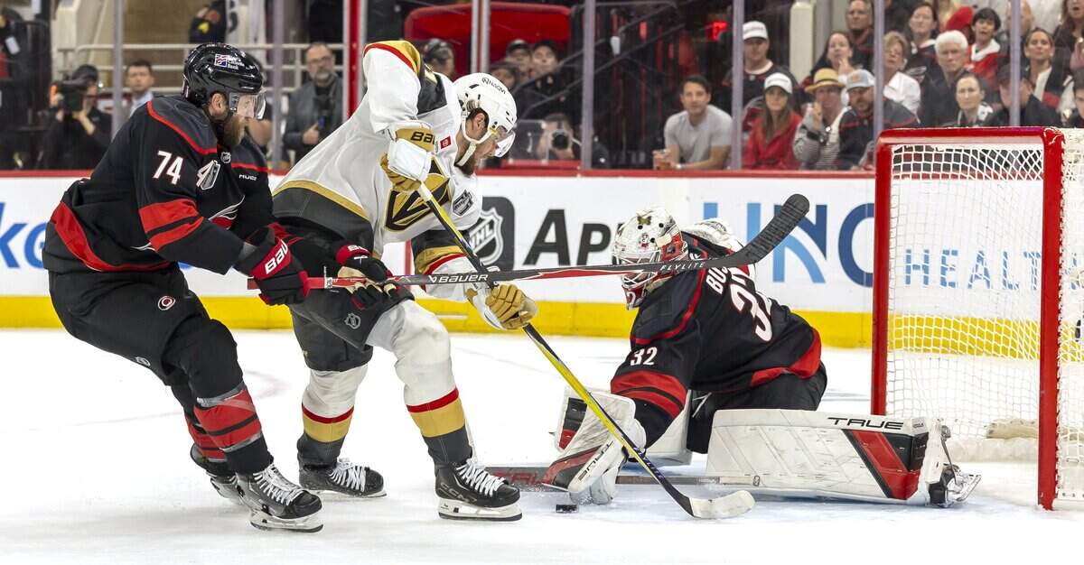 Carolina Hurricanes goalie Brandon Bussi (32) stops a scoring attempt by Vegas center Brett Howden (21) in the second period, in Game 5 of the Stanley Cup Final, on Thursday, June 11, 2026 at Lenovo Center in Raleigh, N.C.