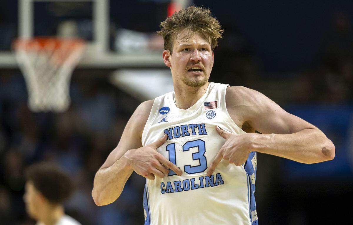 North Carolina center Henri Veesaar (13) reacts after sinking a three-point basket to give the Tar Heels a lead over VCU in the first half on Thursday, March 18, 2026, during the first round of the NCAA Tournament at Bon Secours Arena in Greenville, S.C.