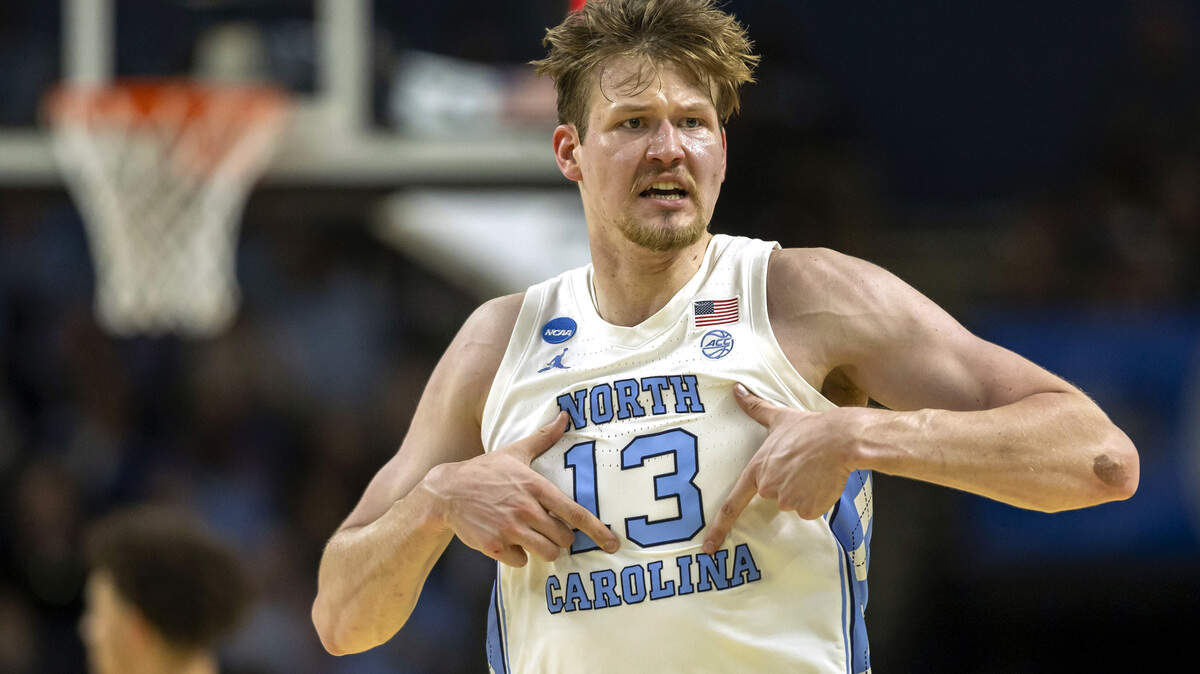 North Carolina center Henri Veesaar (13) reacts after sinking a three-point basket to give the Tar Heels a lead over VCU in the first half on Thursday, March 18, 2026, during the first round of the NCAA Tournament at Bon Secours Arena in Greenville, S.C.