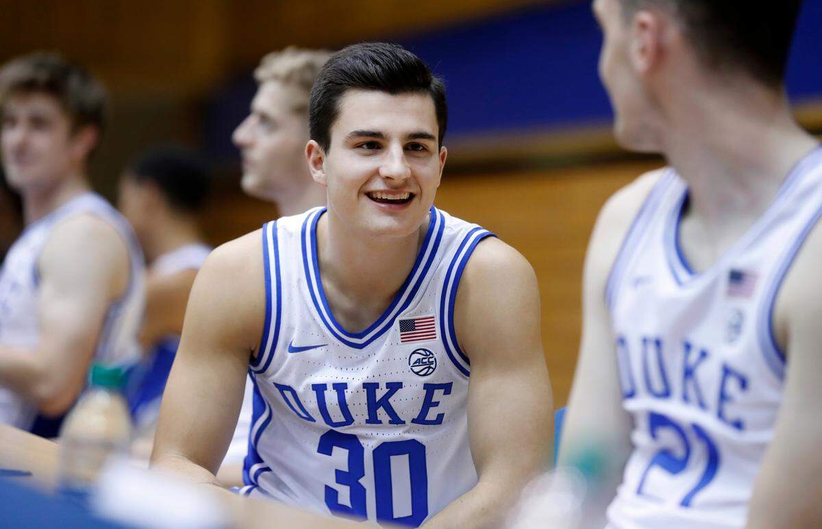 Duke’s Michael Savarino (30), left, talks with Matthew Hurt (21) during Duke basketball’s media day at Cameron Indoor Stadium in Durham, N.C., Monday, Sept. 23, 2019.