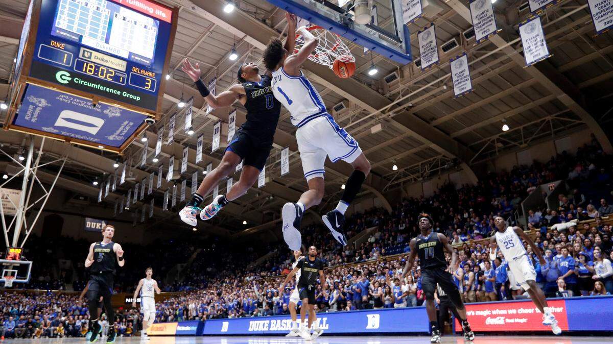 Duke’s Dereck Lively II (1) slams in two as Delaware’s Jameer Nelson Jr. (0) defends during Duke’s 92-58 victory over Delaware at Cameron Indoor Stadium in Durham, N.C., Friday, Nov. 18, 2022.