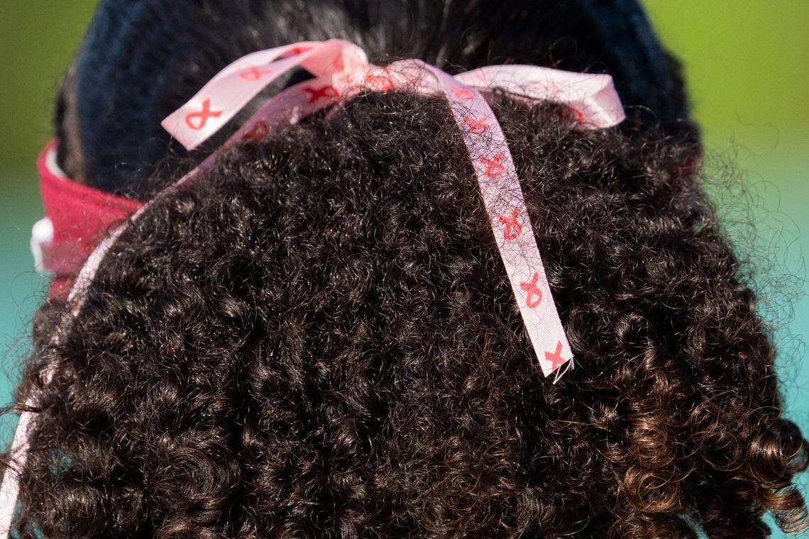 Florida State softball players wear pink bows in their hair honoring coach Lonni Alameda during a game on Wednesday, April 2, 2025.
