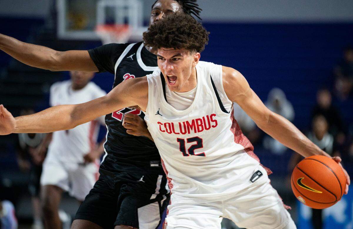 Columbus Explorers forward Cameron Boozer (12) drives to the basket past Archbishop Ryan Raiders forward Jaden Murray (22) during the 50th annual City of Palms Classic at Suncoast Credit Union Arena in Fort Myers on Dec. 19, 2023.