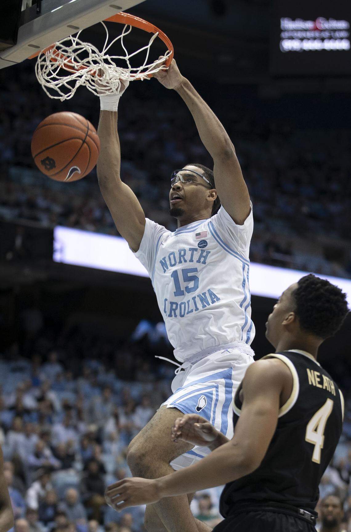 North Carolina’s Garrison Brooks (15) dunks over Wake Forest’s Jahcobi Neath (4) during the first half on Tuesday, March 3, 2020 at the Smith Center in Chapel Hill, N.C.