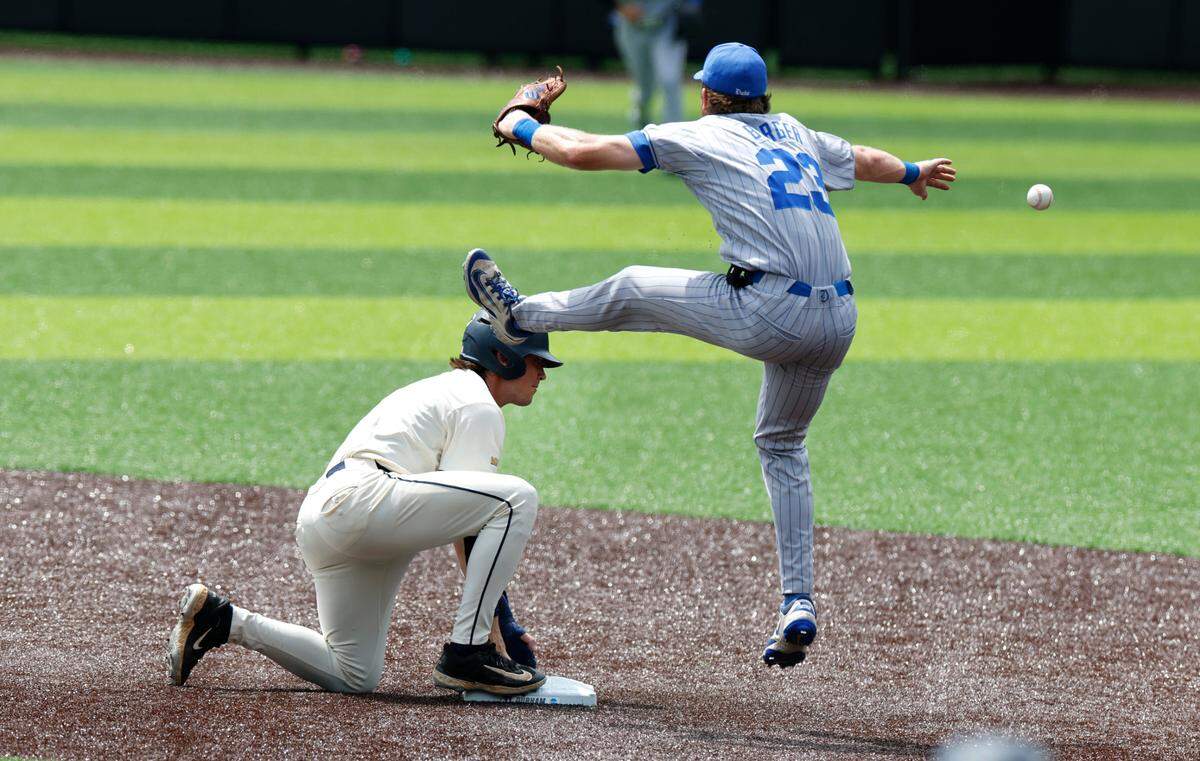 Duke’s Jake Berger (23) can’t pull in the ball as the Blue Devils attempt to tag out Murray State’s Carson Garner (8) during Murray State’s 19-9 victory over Duke in the second game of Durham Super Regional at Jack Coombs Field in Durham, N.C., Sunday, June 8, 2025.
