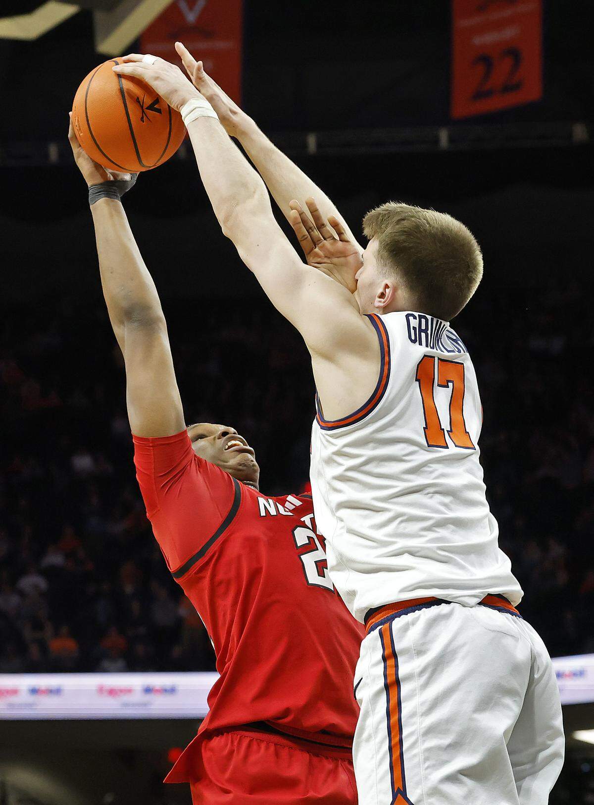 Virginia's Johann Grünloh blocks a shot by N.C. State's Ven-Allen Lubin during the second half of the Wolfpack’s 90-61 loss on Thursday, Feb. 24, 2026, at John Paul Jones Arena in Charlottesville, Va. 