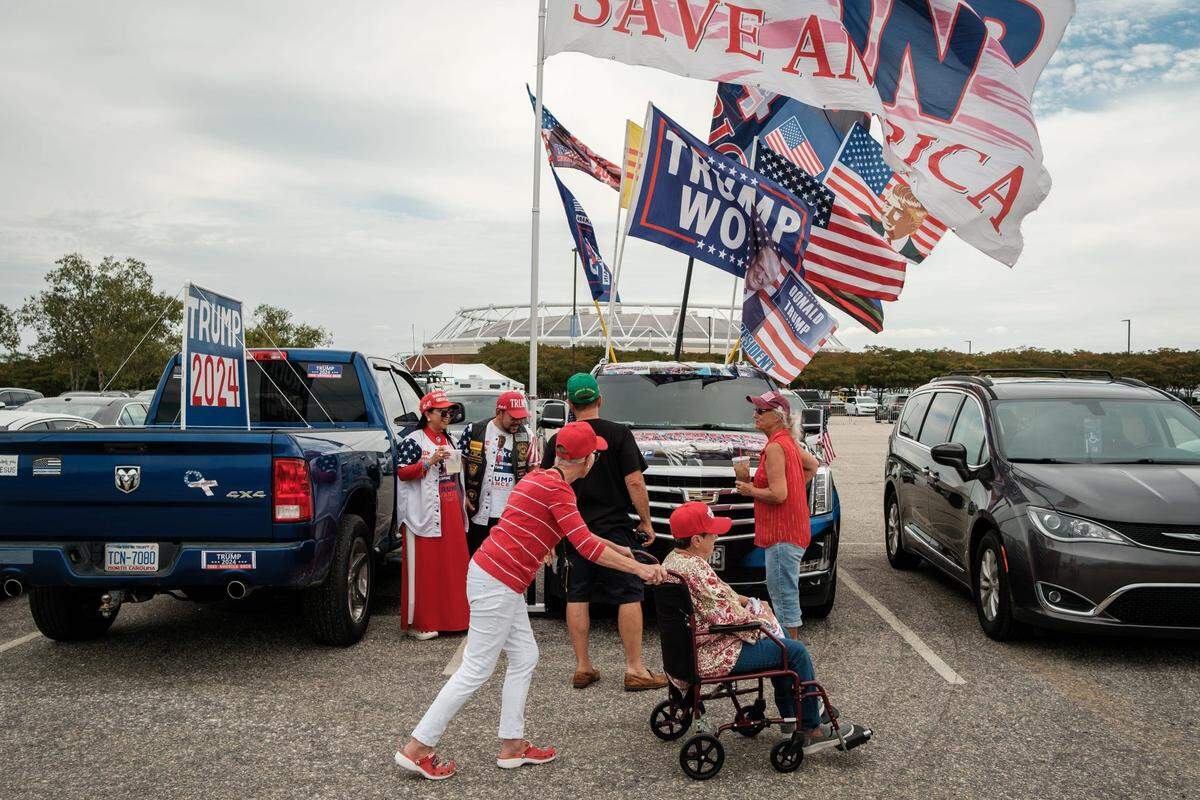 Supporters outside a Trump campaign rally at the Crown Arena on Friday, Oct. 4, 2024, in Fayetteville, N.C.