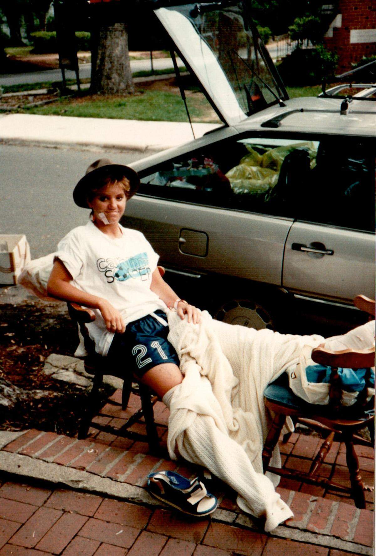 After her accident, Courtney Lehmann waits while her parents packed the car in Chapel Hill to return to Connecticut for the summer.