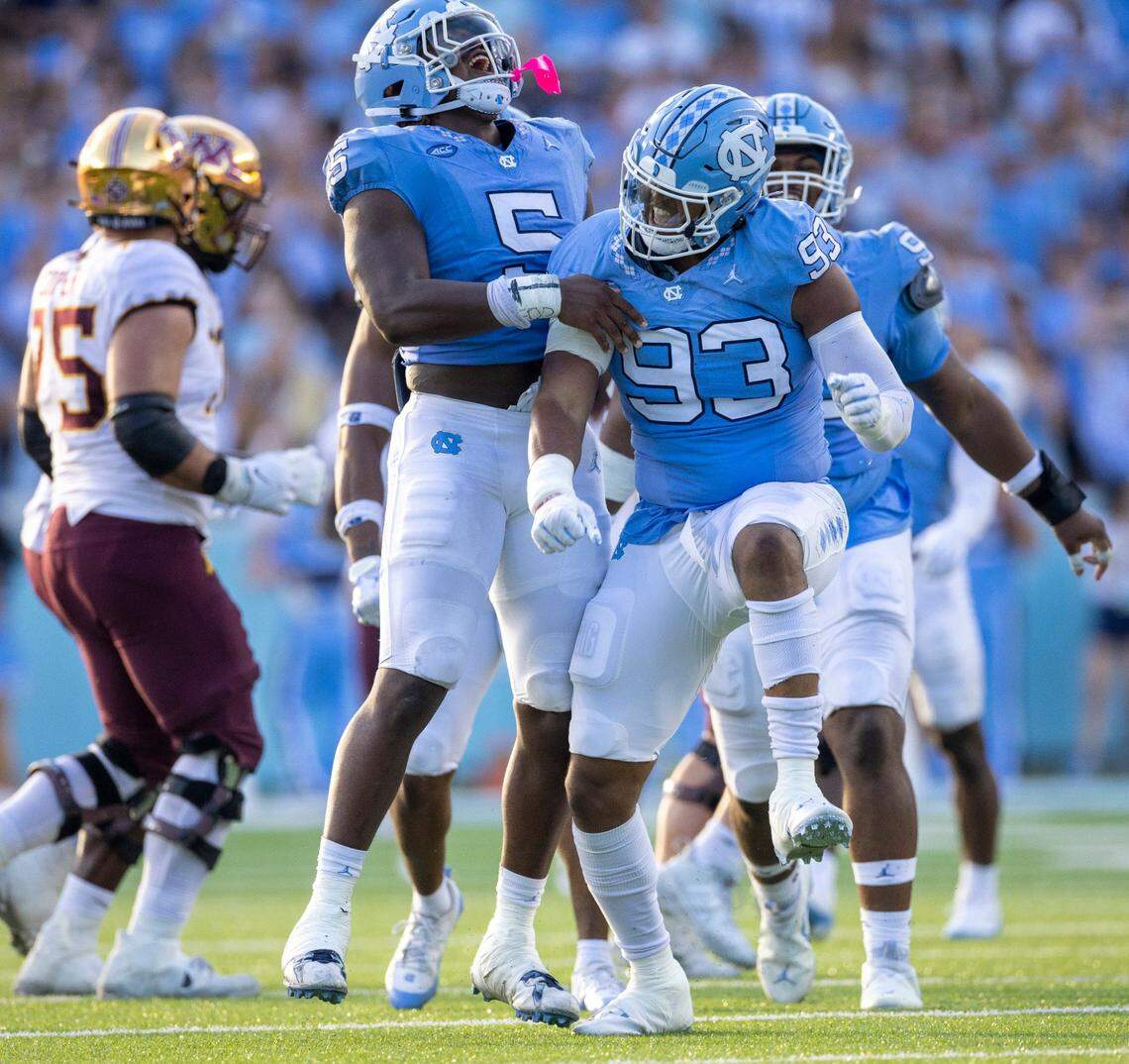 North Carolina’s Jahvaree Ritzie (5) celebrates with Jacolbe Cowan (93) after Cowan’s sack of Minnesota quarterback Athan Kaliakmanis (8) in the fourth quarter on Saturday, September 16, 2023 at Kenan Stadium in Chapel Hill N.C.
