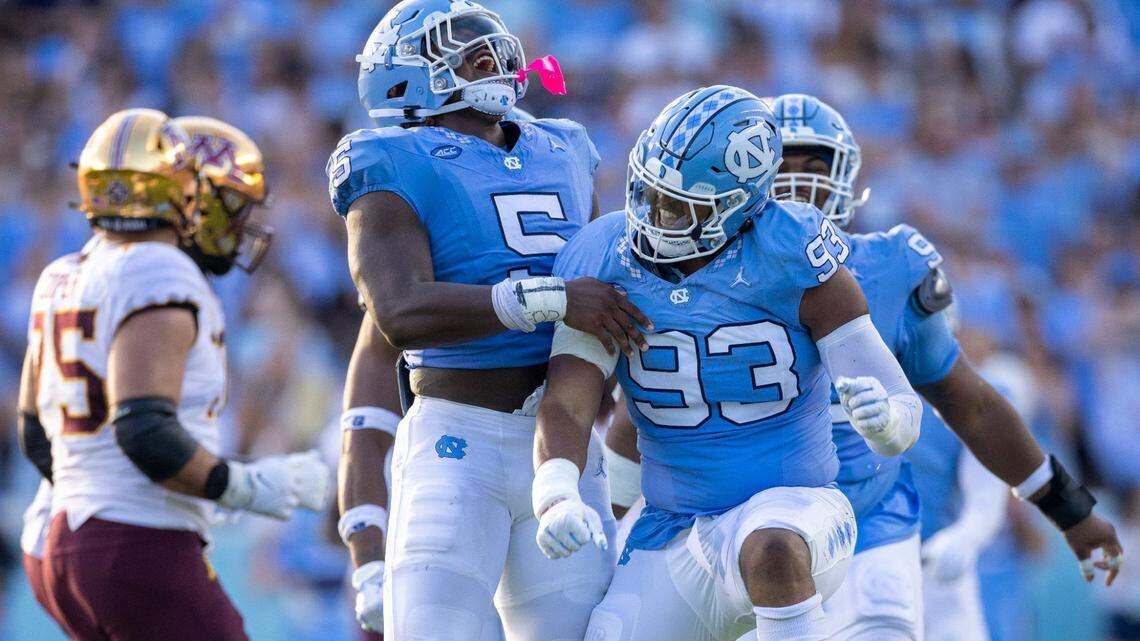 North Carolina’s Jahvaree Ritzie (5) celebrates with Jacolbe Cowan (93) after Cowan’s sack of Minnesota quarterback Athan Kaliakmanis (8) in the fourth quarter on Saturday, September 16, 2023 at Kenan Stadium in Chapel Hill N.C.