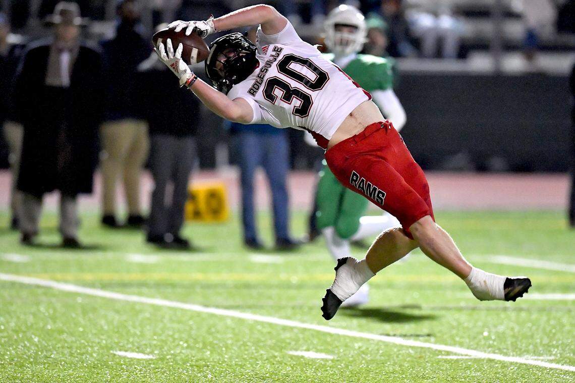Rolesville tight end Jack McHugh (30) makes the catch for the touchdown against Cardinal Gibbons during the first half. The Rolesville Rams and the Cardinal Gibbons Crusaders met in the East Regional Final of the NCHSAA 4A football playoffs in Raleigh, N.C. on December 13, 2024.