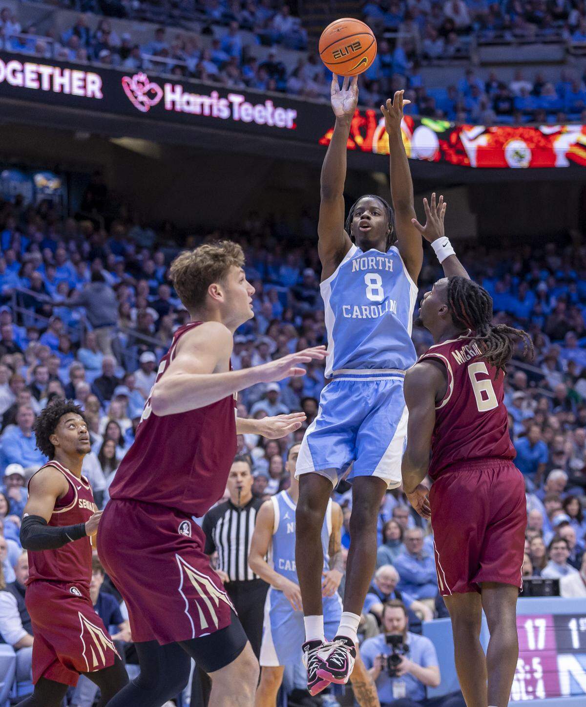 North Carolina forward Caleb Wilson (8) launches a three-point shot over Florida State guard Robert McCray V (6) in the first half against Florida State on Tuesday, December 30, 2025 at the Smith Center in Chapel Hill, N.C.
