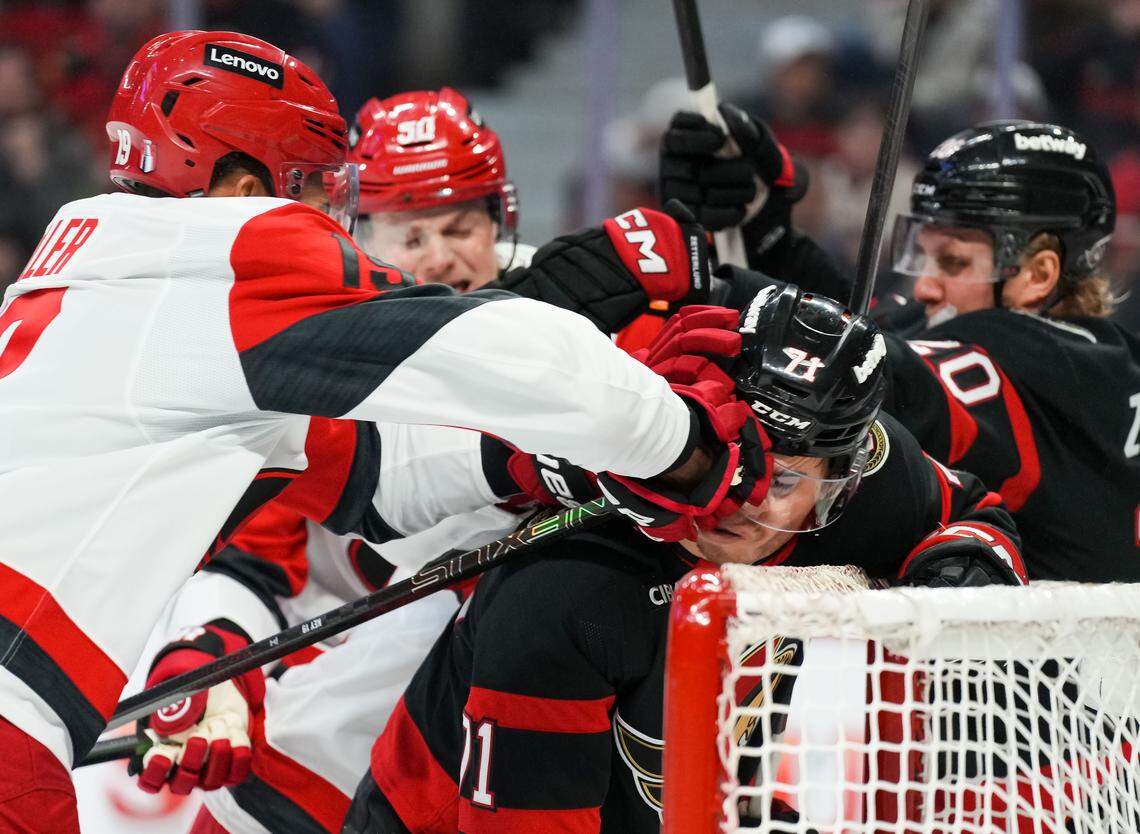 K'andre Miller, left, of the Carolina Hurricanes punches Ridly Greig of the Ottawa Senators during the second period in Game 4 of the first round of the 2026 Stanley Cup Playoffs at Canadian Tire Centre on April 25, 2026 in Ottawa, Canada.