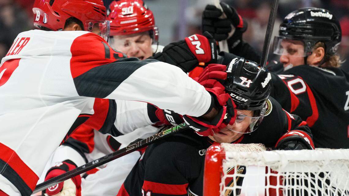 K'andre Miller, left, of the Carolina Hurricanes punches Ridly Greig of the Ottawa Senators during the second period in Game 4 of the first round of the 2026 Stanley Cup Playoffs at Canadian Tire Centre on April 25, 2026 in Ottawa, Canada.