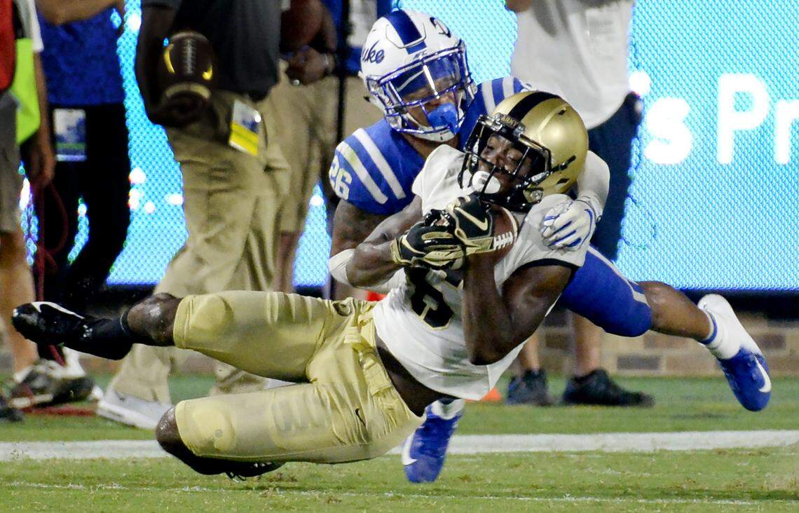 Duke safety Michael Carter II (26) tries to break up a third quarter pass to Army wide receiver Glen Coates. Duke opened the 2018 football season with a win against Army 34-14 at Wallace Wade Stadium in Durham, N.C., Friday, August 31, 2018.