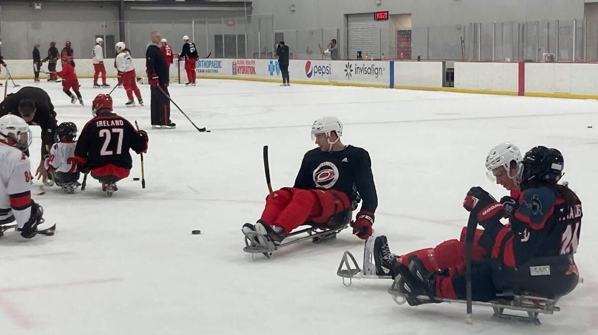 Carolina Hurricanes prospects join members of the Hurricanes Sled Hockey team on the ice during development camp at Invisalign Arena on Wednesday, July 12, 2023.
