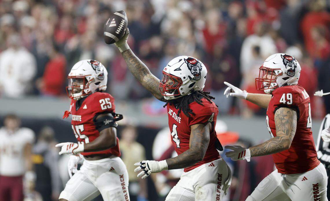N.C. State’s Tra Thomas (4) celebrates after getting the ball after a botched punt return by FSU during the second half of N.C. State’s 21-11 victory over Florida State at Carter-Finley Stadium in Raleigh, N.C., Friday, Nov. 21, 2025.