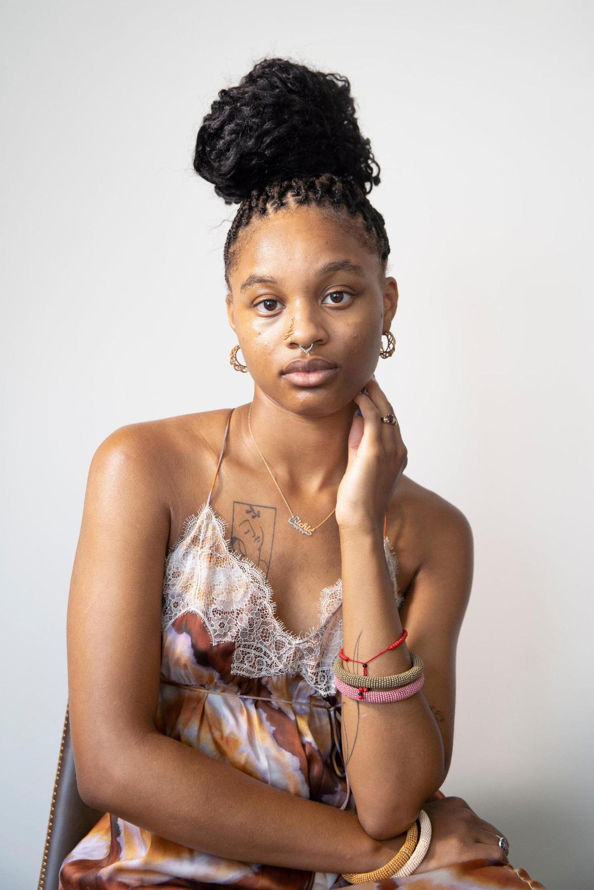 Kennedi Carter, 22, poses for a portrait in her apartment in Durham, N.C., on July 7, 2021. The Durham native was 21 when she became the youngest photographer to shoot a cover for British Vogue.