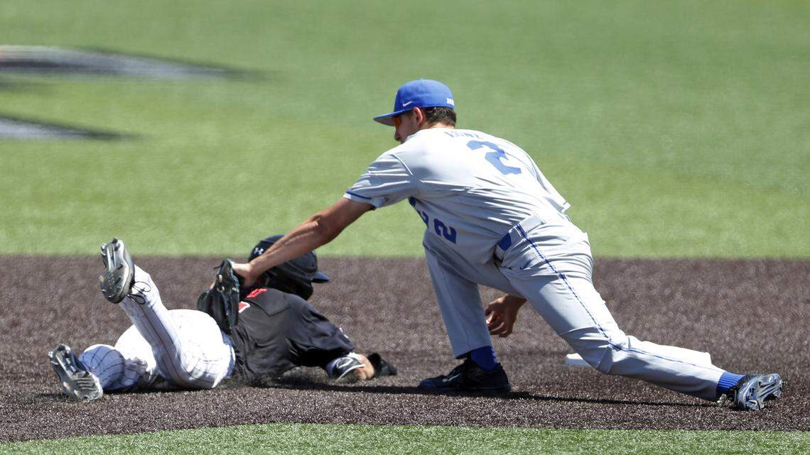 Duke's Zack Kone, right, tags out Texas Tech's Gabe Holt as he slides into second base during the NCAA baseball tournament Super Regional game on Monday in Lubbock, Texas.