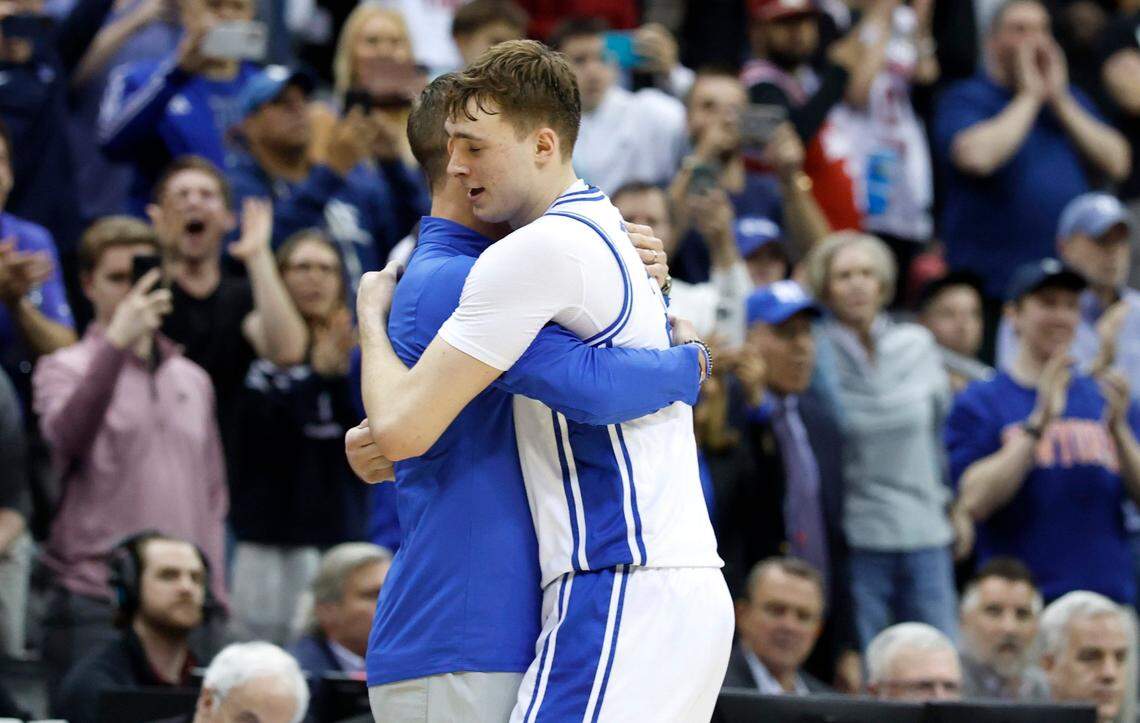 Duke’s head coach Jon Scheyer hugs Cooper Flagg (2) as time expires in Duke’s 85-65 victory over Alabama in their Elite 8 game in the 2025 NCAA Men’s Basketball Championship at the Prudential Center in Newark, N.J., Saturday, March 29, 2025.