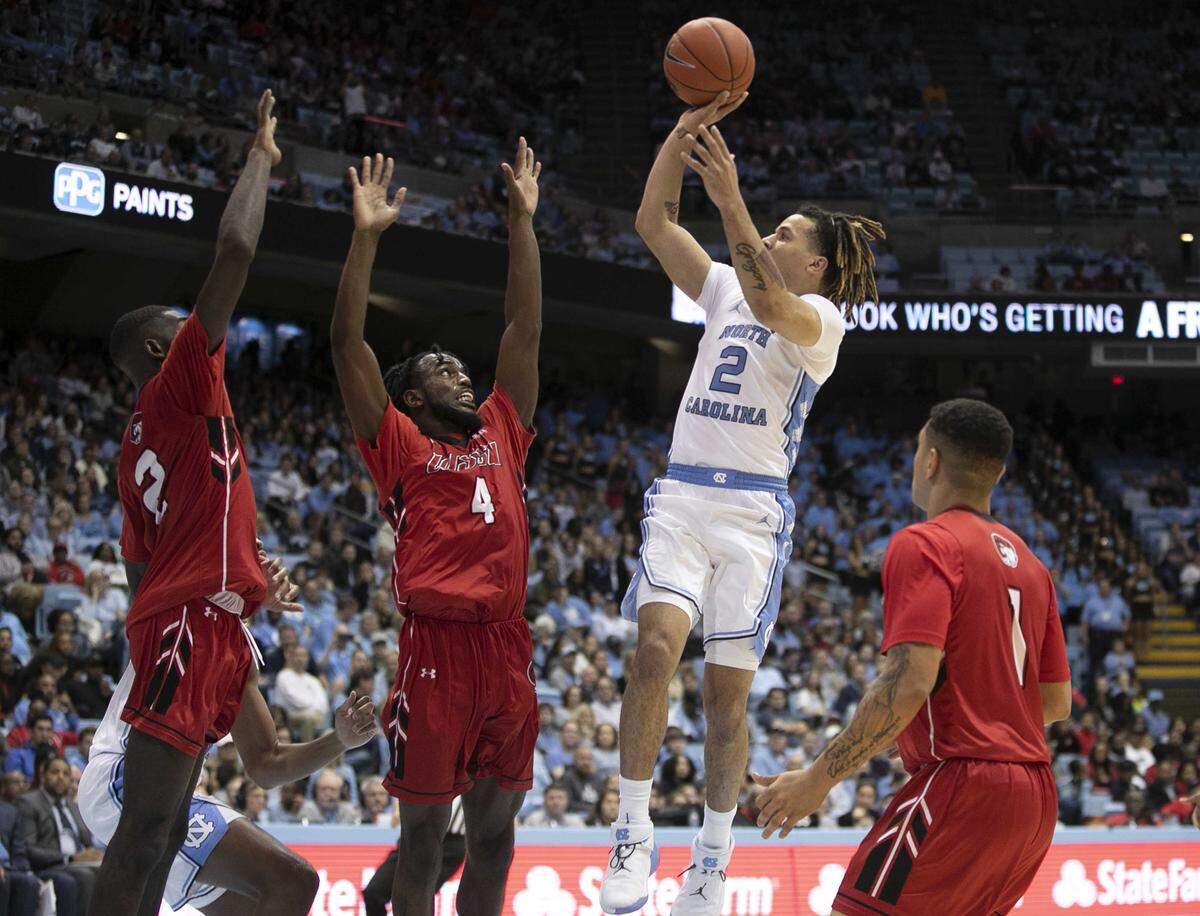 North Carolina’s Cole Anthony (2) drives to the basket against Winston-Salem State’s Jaylen Alston (4) and Mason Harrell (2) during the second half on Friday, November 1, 2019 at the Smith Center in Chapel Hill, N.C. Anthony scored 11 points.