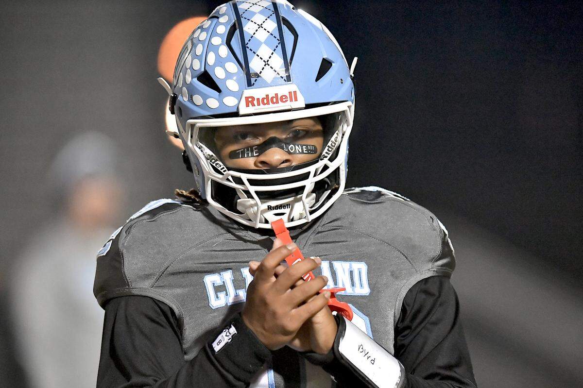 Cleveland quarterback Jackson Byrd (10) between pregame drills before taking on Heritage. The Cleveland Rams and the Heritage Huskies met in the first round of the NCHSAA 4A playoffs in Clayton, N.C. on November 15, 2024.