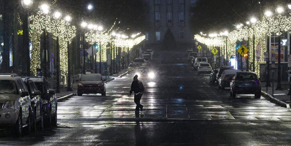 Snow falls in downtown Raleigh, N.C., Monday evening, Dec. 8. 2025.