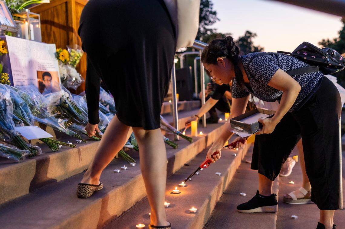 Candles are lit and flowers are laid on the steps of the Cary Arts Center in memory of UNC-Chapel Hill professor Zijie Yan during a candlelight vigil organized by the Chinese American Friends Association of North Carolina and and North Carolina Asian Americans Together on Tuesday evening, Sept. 5, 2023. Yan was shot and killed on campus on Monday, Aug. 28.