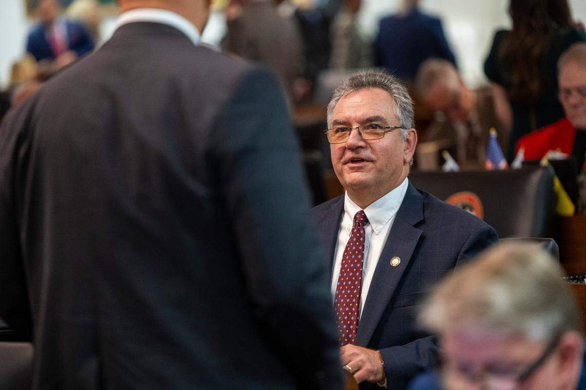 State Rep. Karl Gillespie, a Franklin Republican and the House majority whip, speaks to a colleague on the House floor on Wednesday, Dec. 11, 2024.