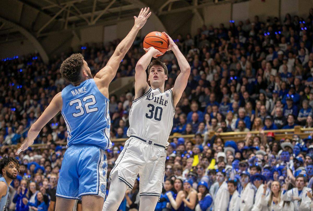 Duke’s Kyle Filipowski (30) puts up a shot against North Carolina’s Pete Nance (32)) during the first half on Saturday, February 4, 2023 at Cameron Indoor Stadium in Durham, N.C.