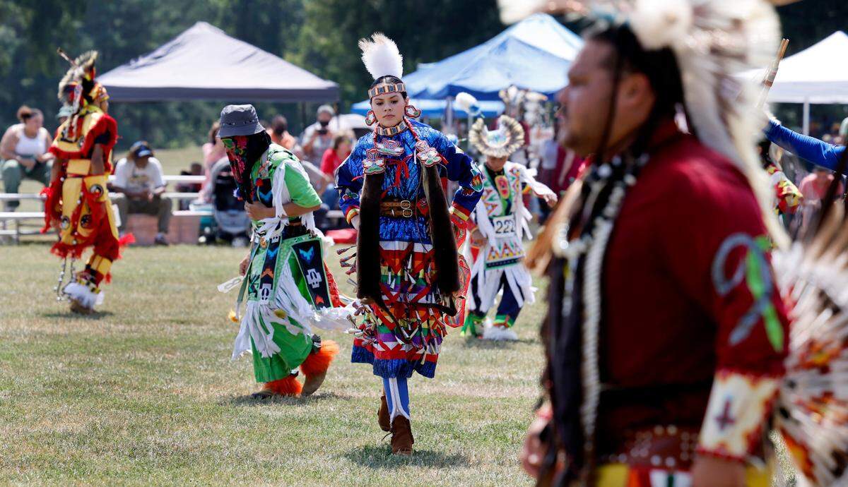 Attendees participate in a blanket dance during the Dix Park Inter-Tribal Pow Wow in Raleigh, N.C., Saturday, August 26, 2023.
