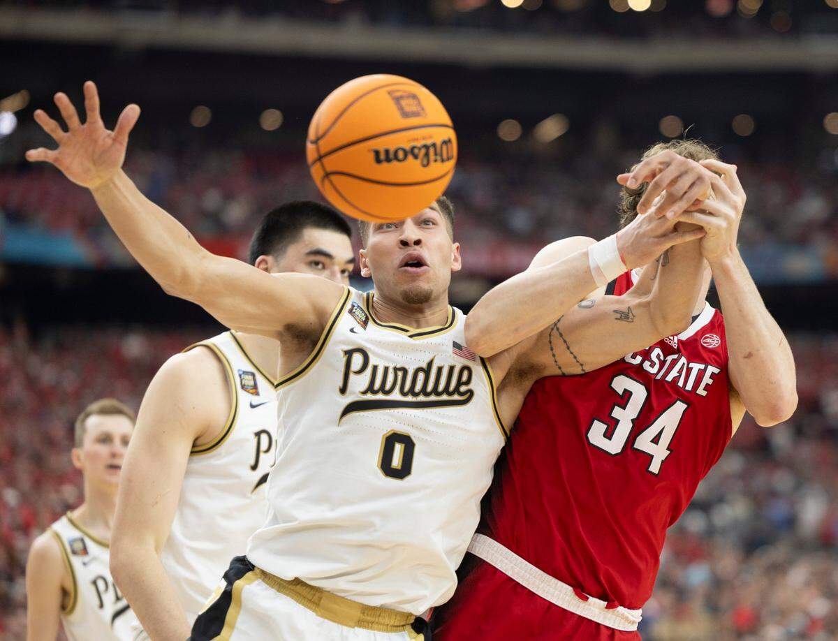 Purdue’s Mason Gillis (0) battles with N.C. State’s Ben Middlebrooks (34) for a rebound during the first half in the NCAA Final Four National Semifinal on Saturday, April 6, 2024 at State Farm Stadium in Glendale, AZ.
