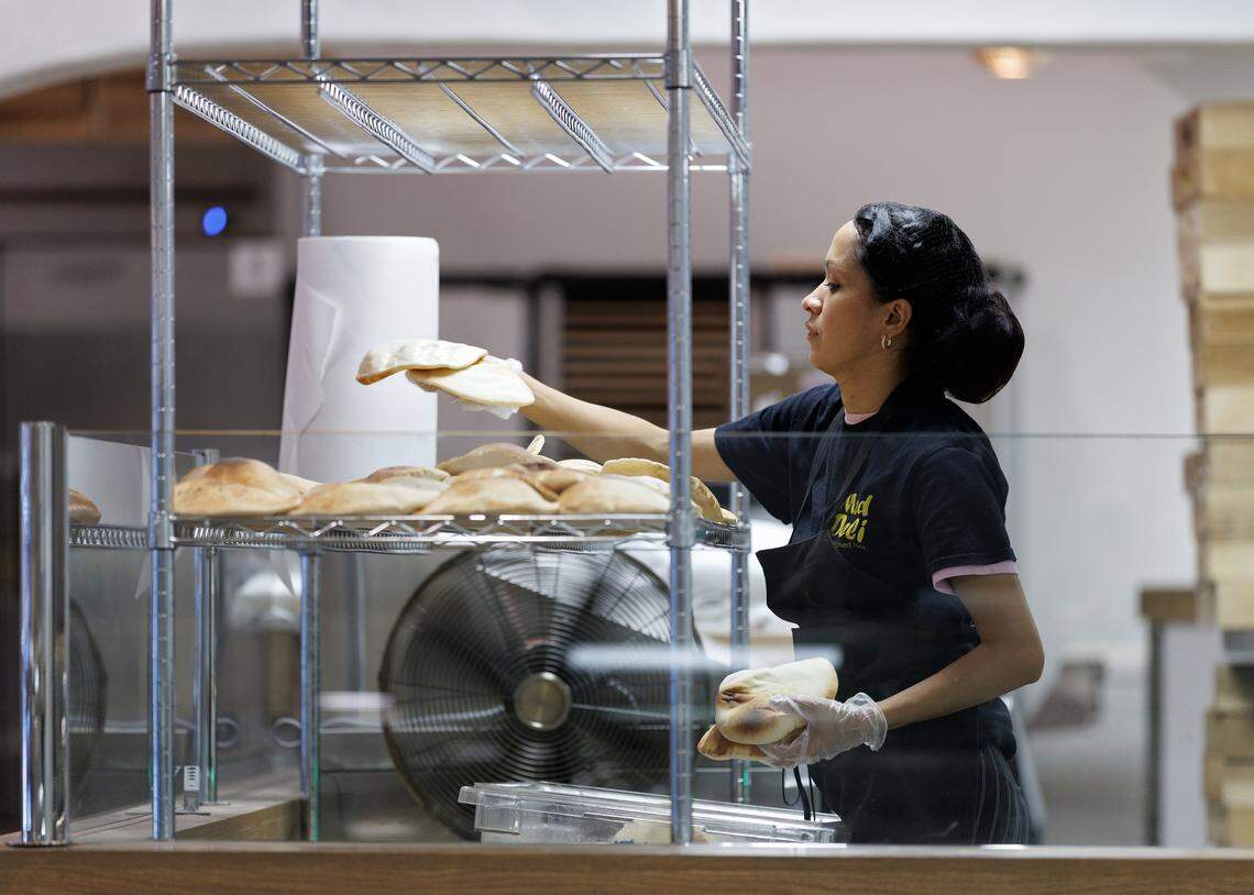 Kelin Velasquez works to prepare pita bread at Mediterranean Deli on Thursday, Sept. 4, 2025, in Chapel Hill, N.C. The restaurant will reopen on Tuesday following a July 2023 fire.