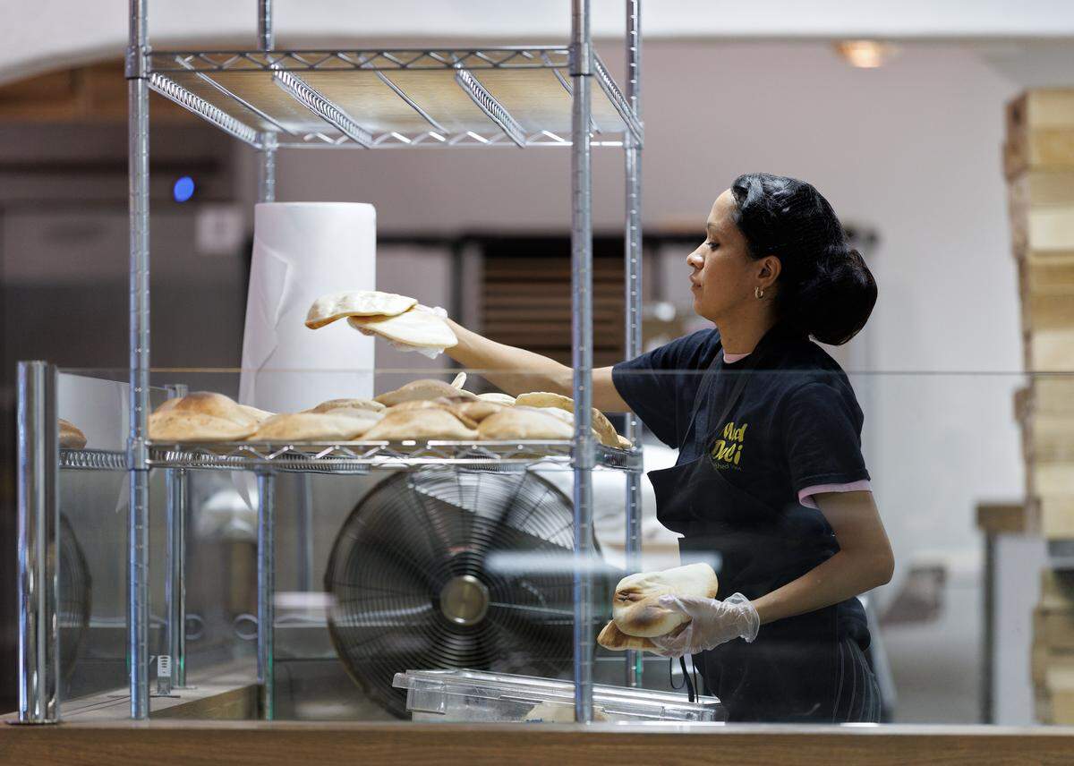 Kelin Velasquez works to prepare pita bread at Mediterranean Deli on Thursday, Sept. 4, 2025, in Chapel Hill, N.C. 