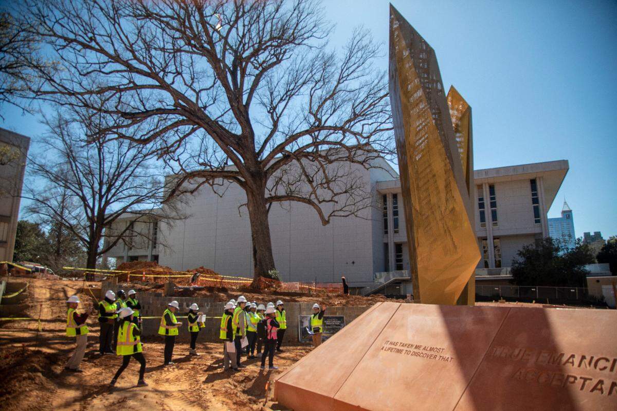 A 10th-grade honors civic literacy class from Wake Early College of Information and Biotechnology in Morrisville tours the construction site of the North Carolina Freedom Park in downtown Raleigh in a file photo from March 2023. The new park honors the African American experience in North Carolina.